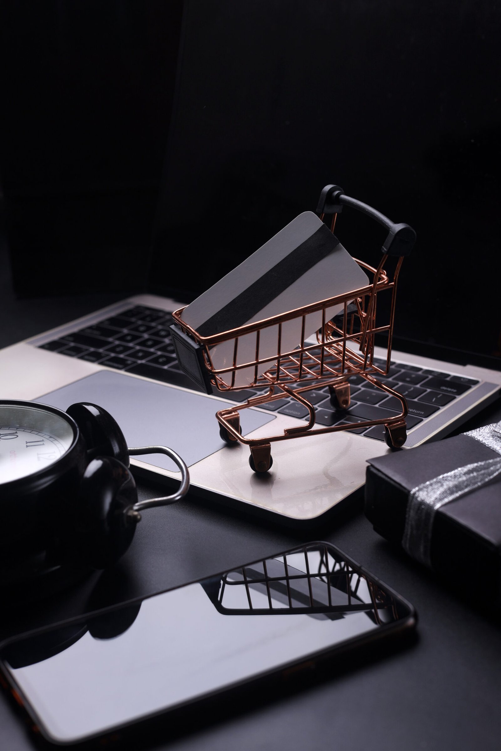 https://rishfotech.com/wp-content/uploads/2025/09/black-friday-concept-with-technology-mini-trolley-alarm-clock-gift-box-smartphone-laptop-iso-scaled.jpg