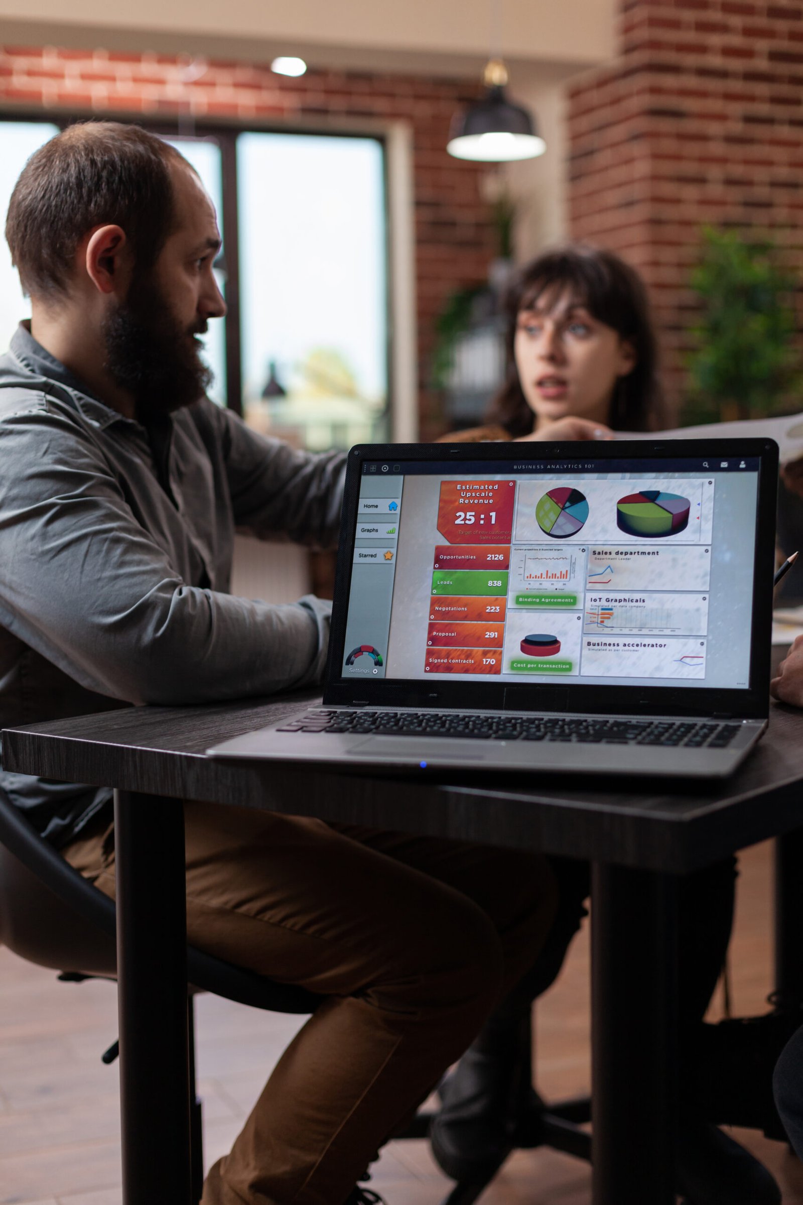 https://rishfotech.com/wp-content/uploads/2025/09/laptop-computer-having-marketing-project-graphs-screen-while-multiethnic-businesspeople-discussing-company-turnover-startup-office-diverse-team-planning-business-collaboration-1-scaled.jpg