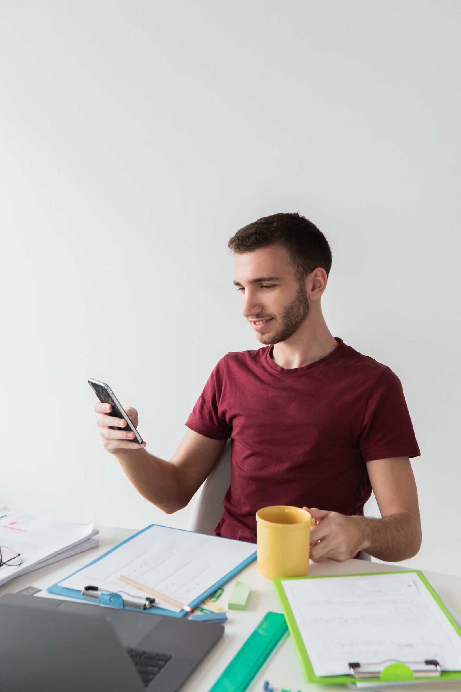 https://rishfotech.com/wp-content/uploads/2025/09/man-sitting-chair-looking-his-phone-scaled.jpg
