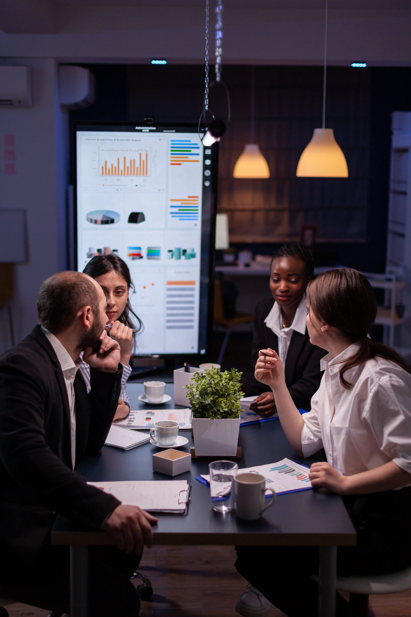 https://rishfotech.com/wp-content/uploads/2025/09/workaholics-businesspeople-brainstorming-financial-company-ideas-scaled.jpg